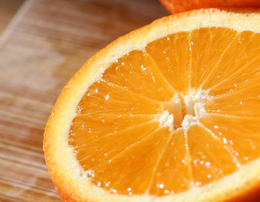 woman drinking vitamin c turmeric ginger orange wellness shot
